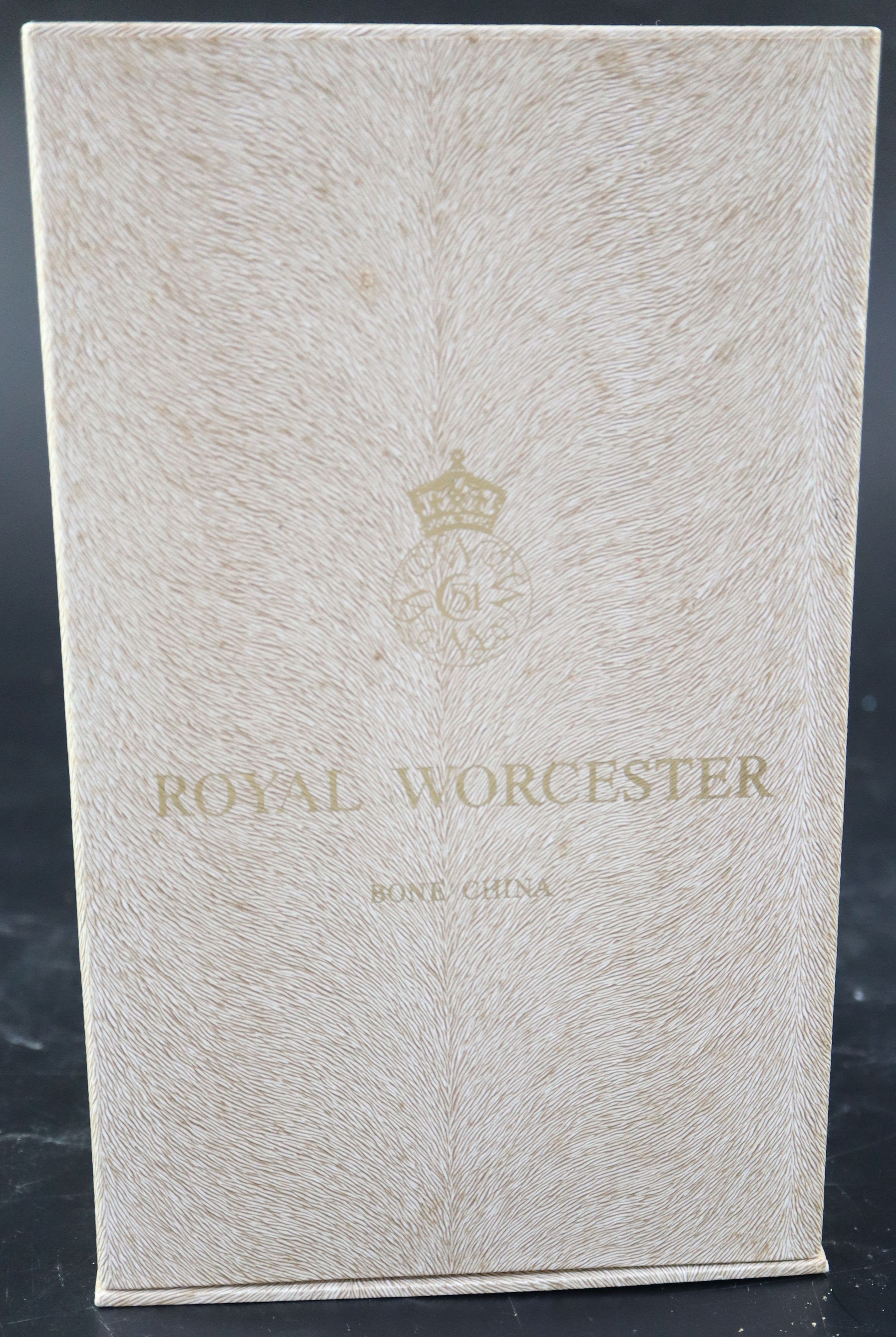 A Royal Worcester model of a British Red Cross Society V.A.D. Member, height 22cm